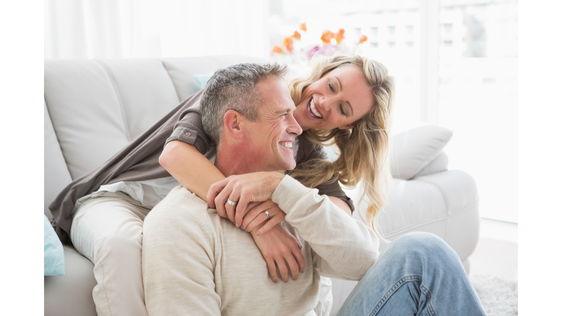 A couple sharing a moment of warmth on the sofa